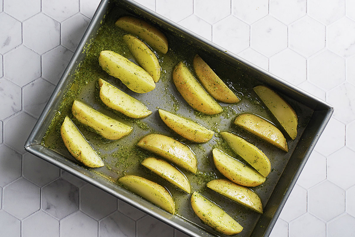Potato slices in a baking tray.