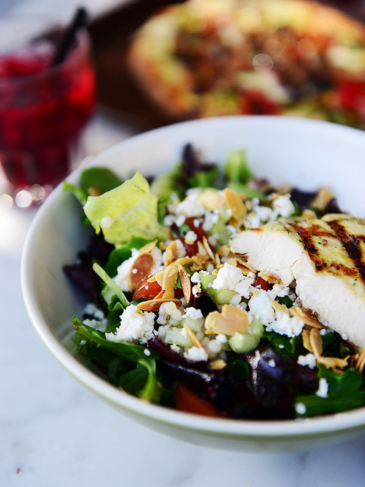 Picture of a salad with grilled chicken.