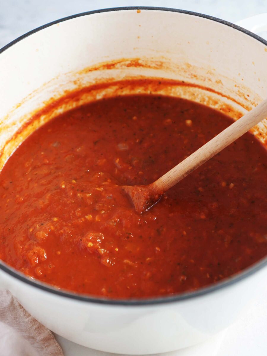 A saucepan with spaghetti sauce.