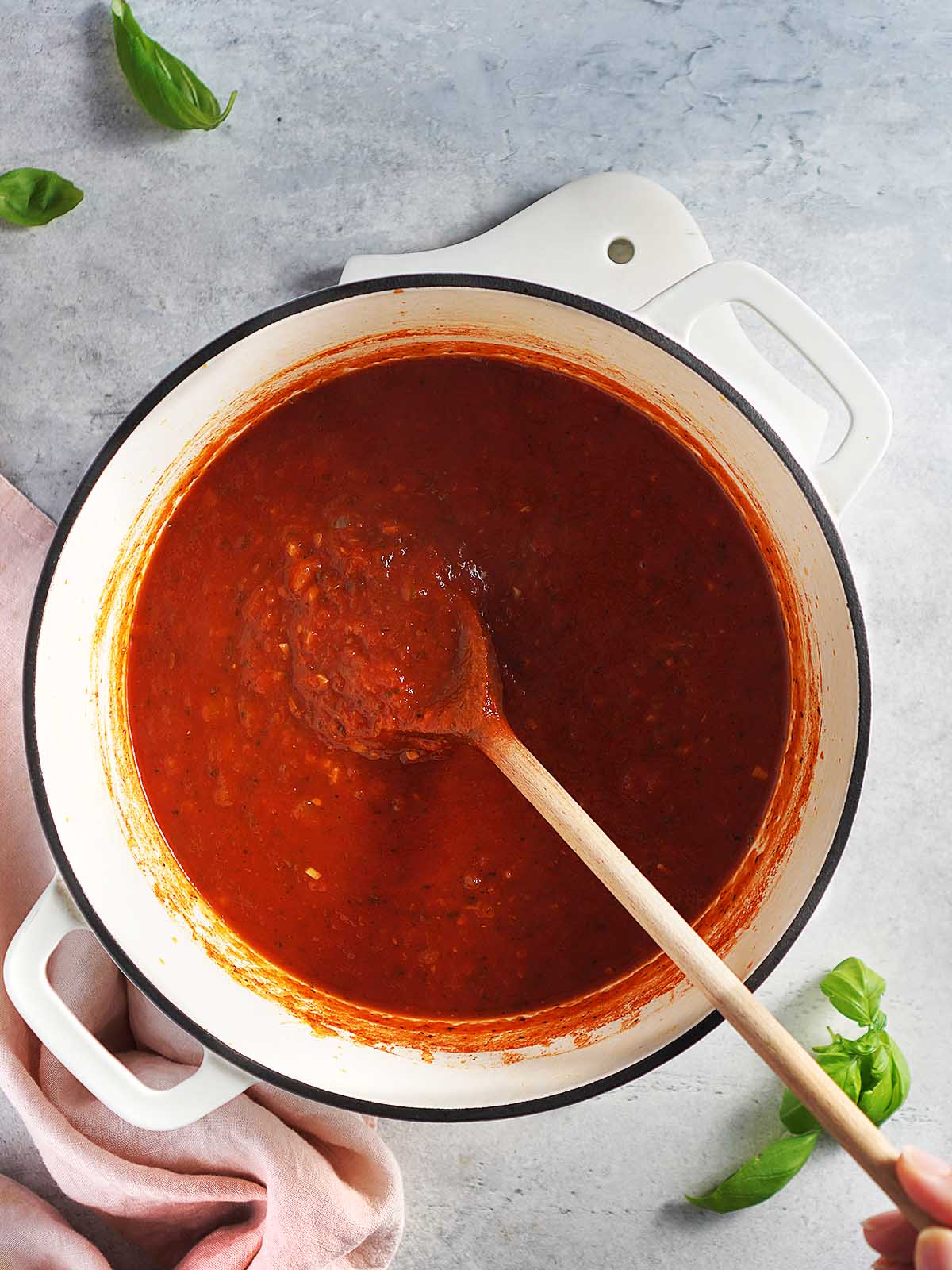 A saucepan with spaghetti sauce.