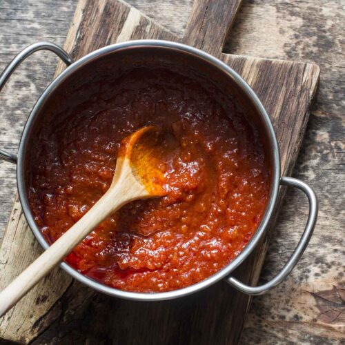 A saucepan with spaghetti sauce.