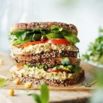 Two sandwiches stacked on top of each other.