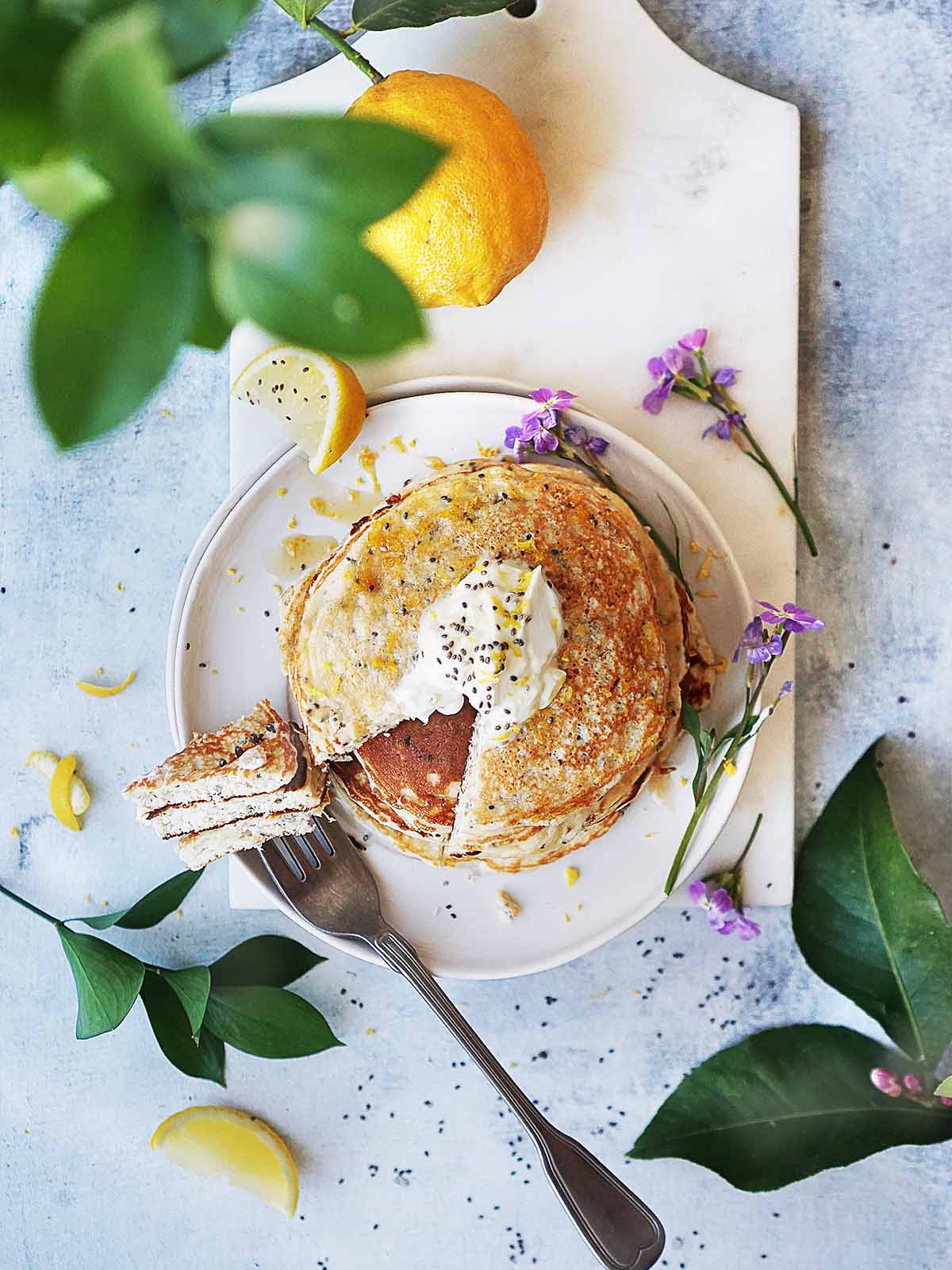 Pancakes with a lemon on the side.