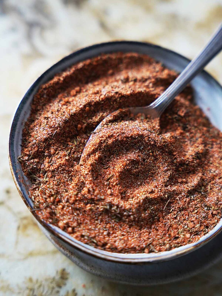 Essence seasoning in a bowl with a spoon.